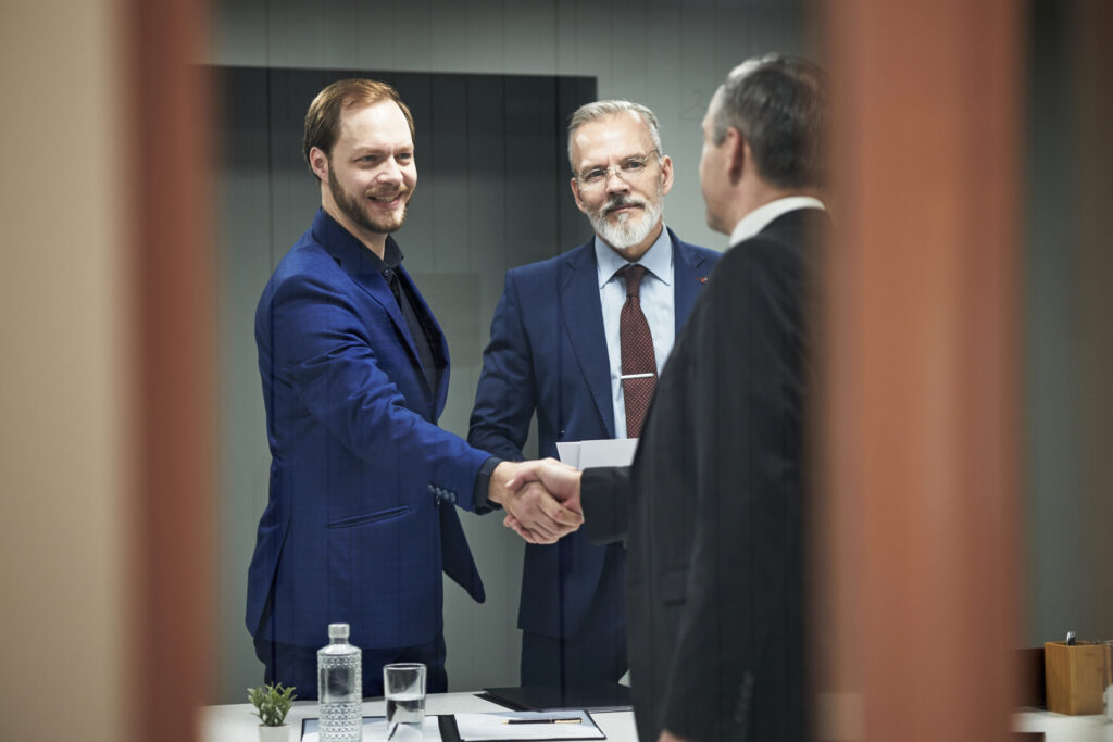 caucasian young man shaking hands with middle aged 2025 09 04 18 37 20 utc scaled.jpg